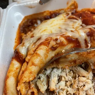 Chicken breast in the wet burrito (sauce on top is mild)