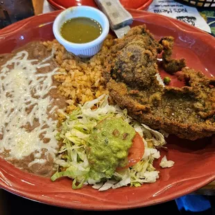 Steak Milenesa so tender inside and crispy outside. The beans and rice go so great together.