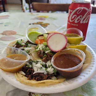 Carne asada, pastor, and chorizo tacos with 4 different sauces and toppings!!!
