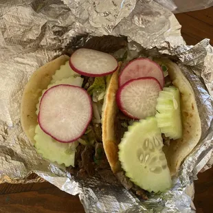 Perfect carne asada tacos with adorable cucumbers and radishes. $2.98 for both. A steal!
