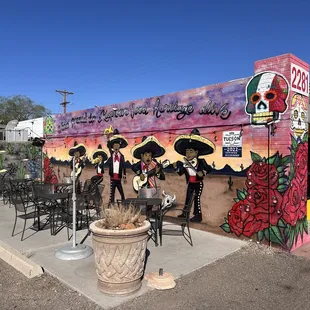 a mexican restaurant with a colorful mural