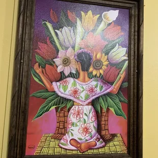 a painting of a woman with flowers