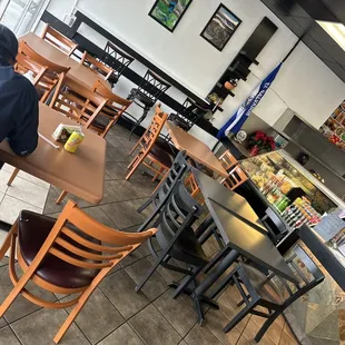 a man sitting at a table in a restaurant