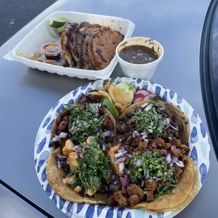 Top: Quesabirria with Consommé. Bottom: Steak, Pork, Shrimp &amp; Chicken tacos.