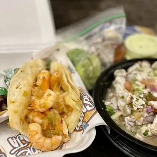 To-Go order! Surf n Turf and Gobernador (shrimp) Tacos accompanied w/ a mixed (Fish n Shrimp) ceviche.