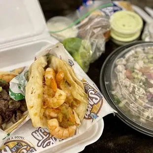 To-Go order! Surf n Turf and Gobernador (shrimp) Tacos accompanied w/ a mixed (Fish n Shrimp) ceviche.