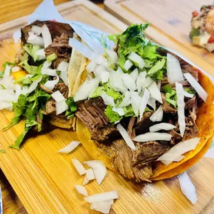 Left asada tacos  Right birria tacos