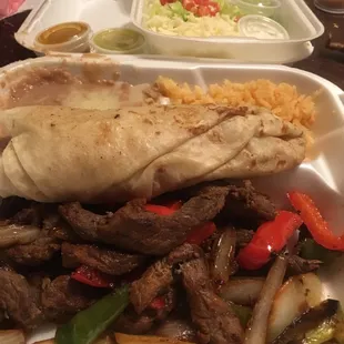 Sizzling steak fajitas with rice, beans and Pico