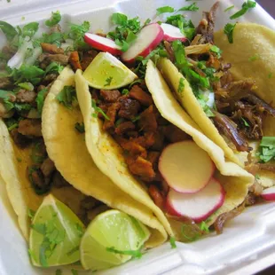 Marinated pork, roast pork and steak tacos.
