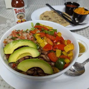 Vegan bowl (from the Mexican menu) and Beans &amp; Loroco Vegan Papusa (from the Salvadoran menu). Both orders were very fresh and delicious!