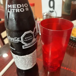 a bottle and a glass