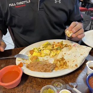 Chicharrónes with eggs potatoes and beans