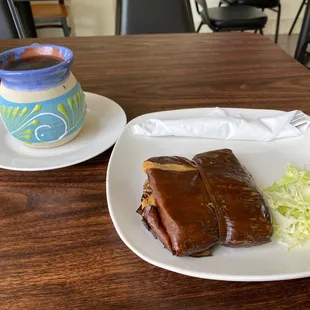 a plate of food and a cup of coffee