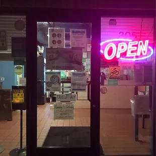 the open sign in the window