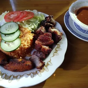 carne frita with fried plantains, rice, salad and gandules. finger liking good!