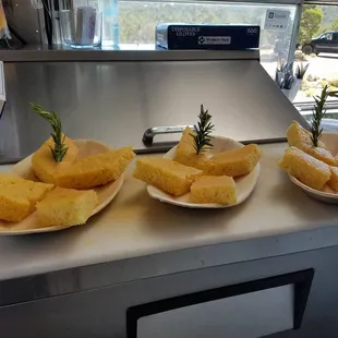 three plates of food on a counter