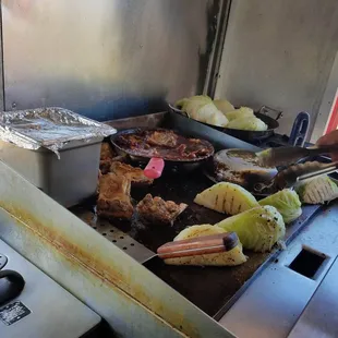 a person cooking food on a grill
