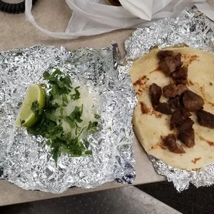 Dried Pork Chunks, Microwaved trying to pass as Carnitas.