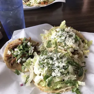 Two shrimp tacos and one carnitas taco