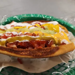 a hot dog with condiments