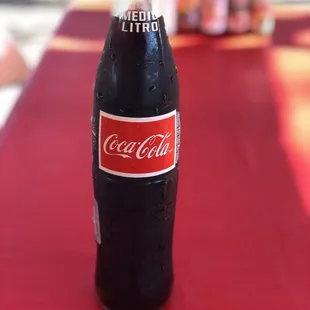a coke bottle on a table