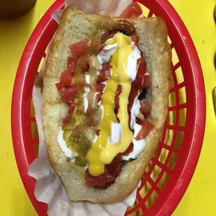 a hot dog with mustard and ketchup