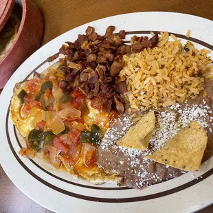 Huevos rancheros combination plate with a side of bacon