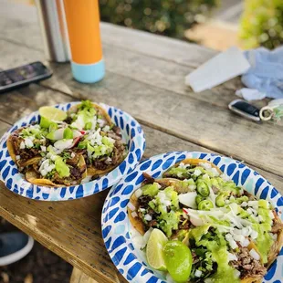 Left taco plate: 2 lengua, 2 al pastor Right taco plate: lengua, cabeza, carnitas, al pastor