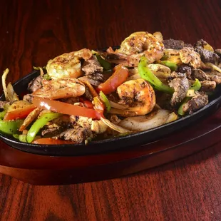 El Sabroson Fajitas. 11.99 comes with rice, refried beans, tortillas and a side salad.