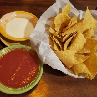 Warm Tortilla chips with salsa and queso