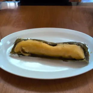 Chicken tamale - made with chicken, potatoes, &amp; bell peppers wrapped in a banana leaf. So flavorful!