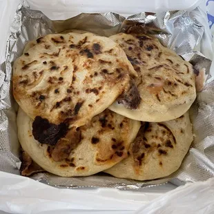 Pupusas revuelta. (Bean, cheese, and pork)