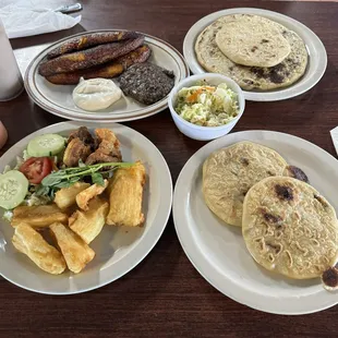 Platano fritos, chicken pupusa, carne asada pupusa, pupusas loca, and yuca frita