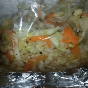 I have no idea what this is called,  so i'll just Americanized it and call it cole slaw. It compliments the pupusas very well :)