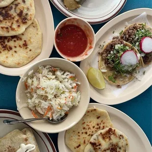 Pupusa, kimchi slaw, steak tacos, steak burrito, tamale