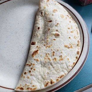 A baleada - think yummy breakfast quesadilla with beans, eggs, avocado and something else inside that I&apos;m forgetting