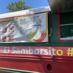 a sign on the side of a food truck