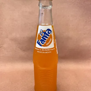 a bottle of orange soda