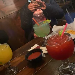 Mango Margarita, Lime Margarita &amp; a pomegranate Margarita all on the rocks