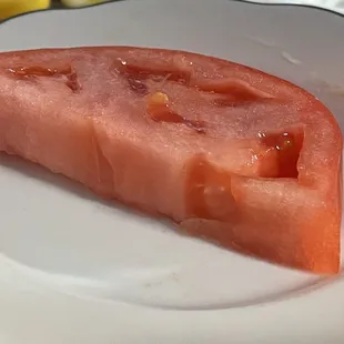 a slice of watermelon on a plate