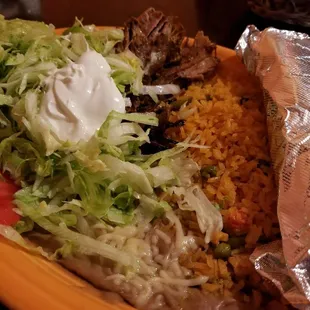 Carnitas platter. There is a massive piece of pork hiding under the lettuce.