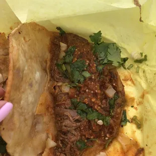 Birria taco with red salsa. A little light on the onions.