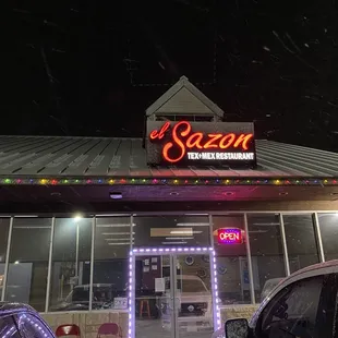 cars parked in front of a restaurant