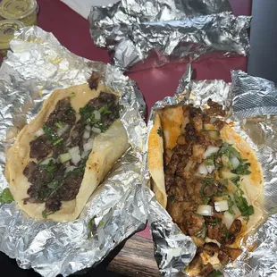 two burritos wrapped in foil