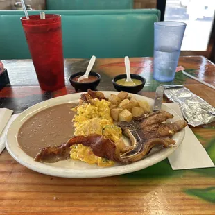 Juevos rancheros migas with side porkchop Legit