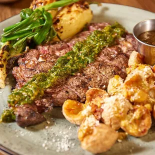 a plate of steak and potatoes