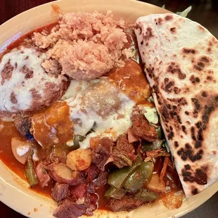 Flour taco, steak ranchera, beef enchilada, rice, refried beans.