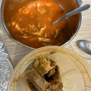 a bowl of soup and a bowl of meat