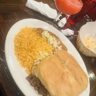 torta de asada (steak sandwich) with a strawberry margarita.