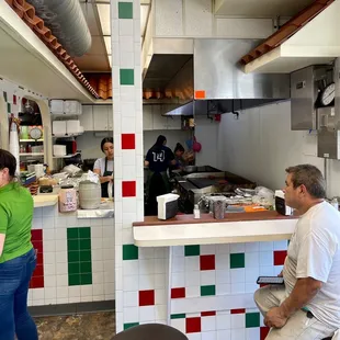a man and a woman in the kitchen